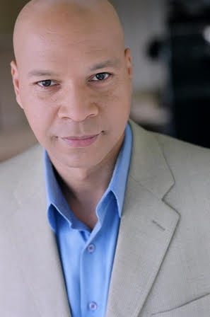 Professional headshot of Dwane Brown